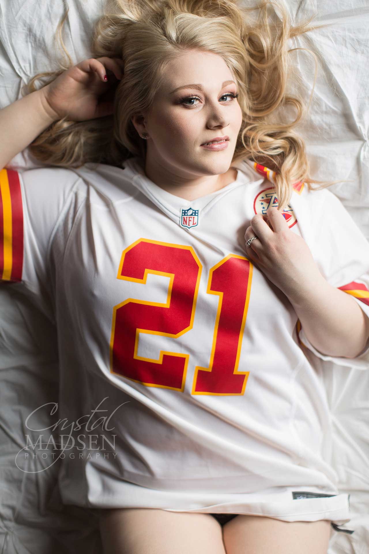 boudoir photo shoot with football jersey.
