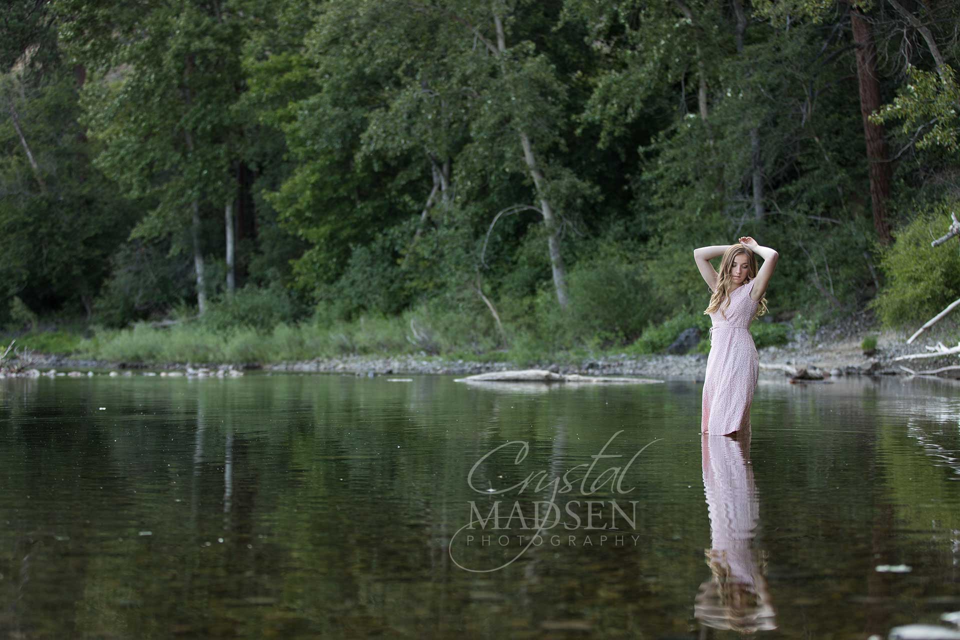 teen girl standing in water with reflection